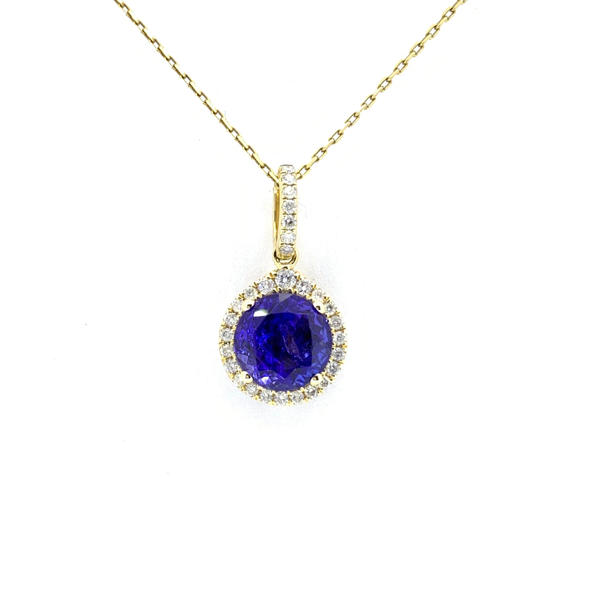 TANZANITE AND DIAMOND HALO PENDANT