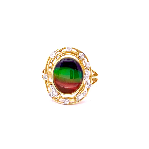 OVAL SHAPE AMMOLITE AND DIAMOND RING