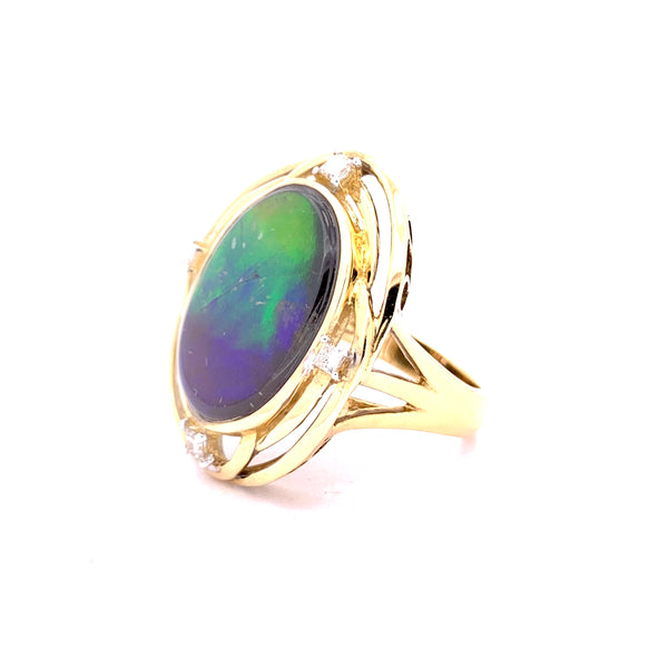 OVAL SHAPE AMMOLITE AND DIAMOND RING